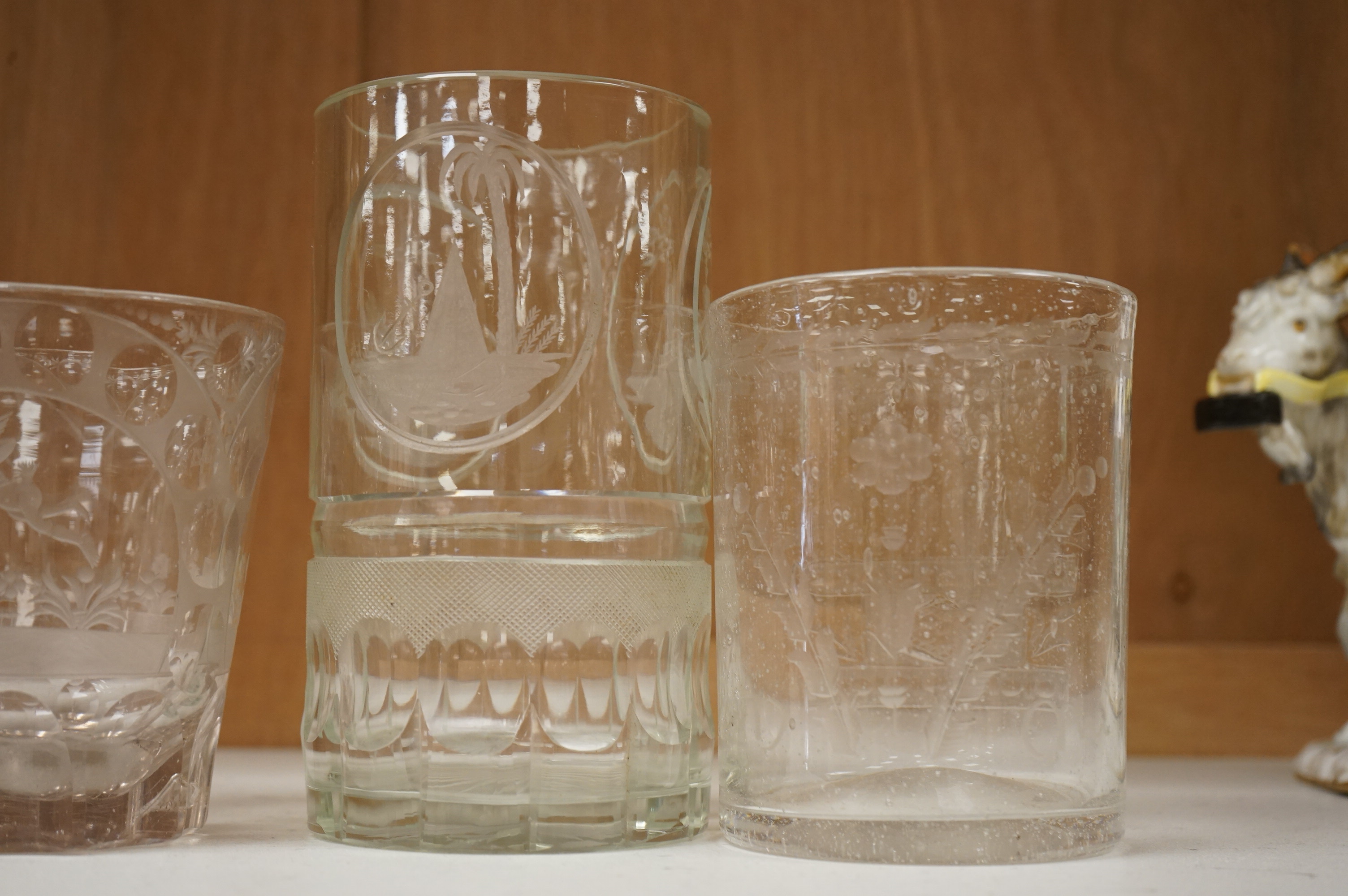 Four German or Bohemian engraved glass beakers, 19th century, largest 16cm high